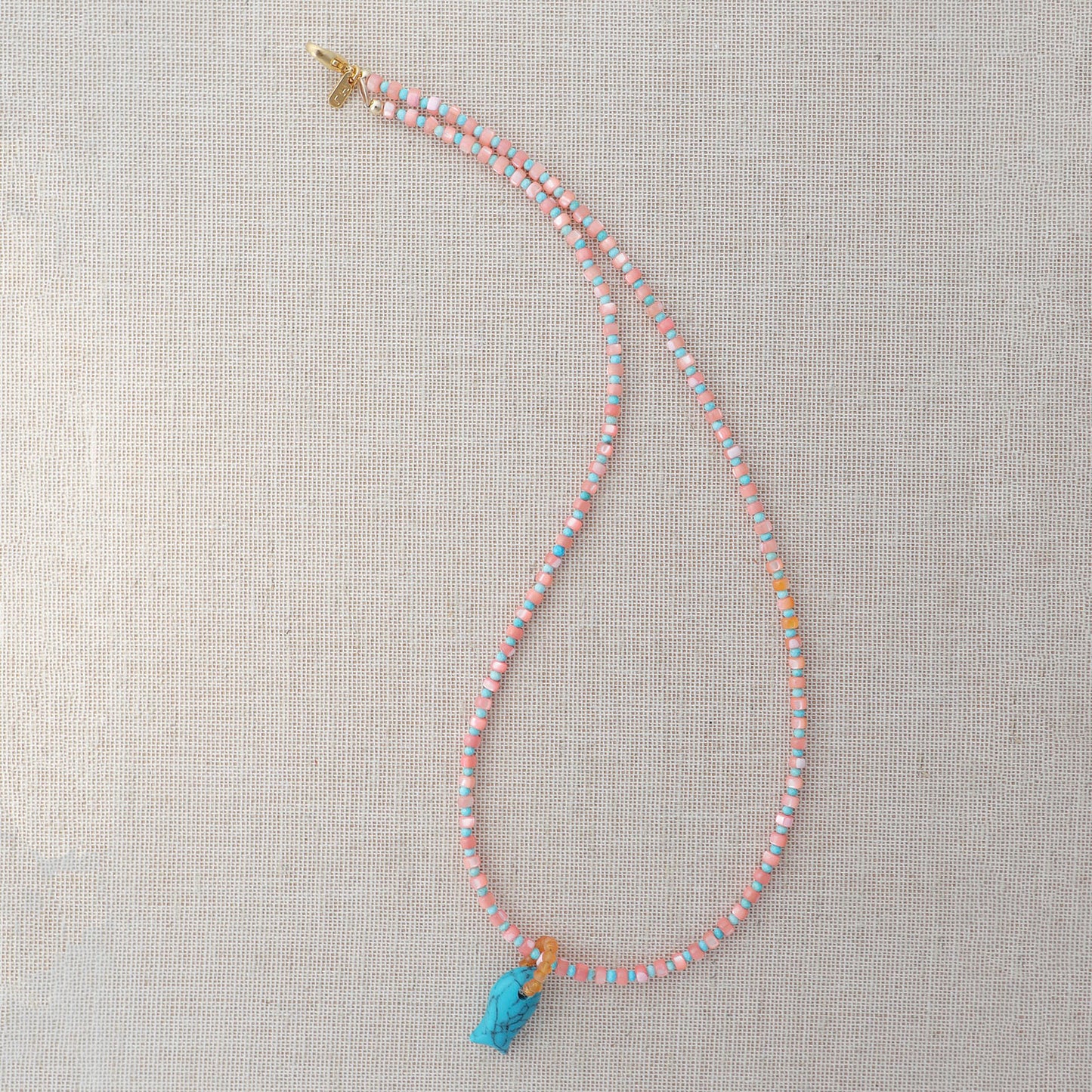 Peach Palma Necklace With Turquoise Quartz Fish
